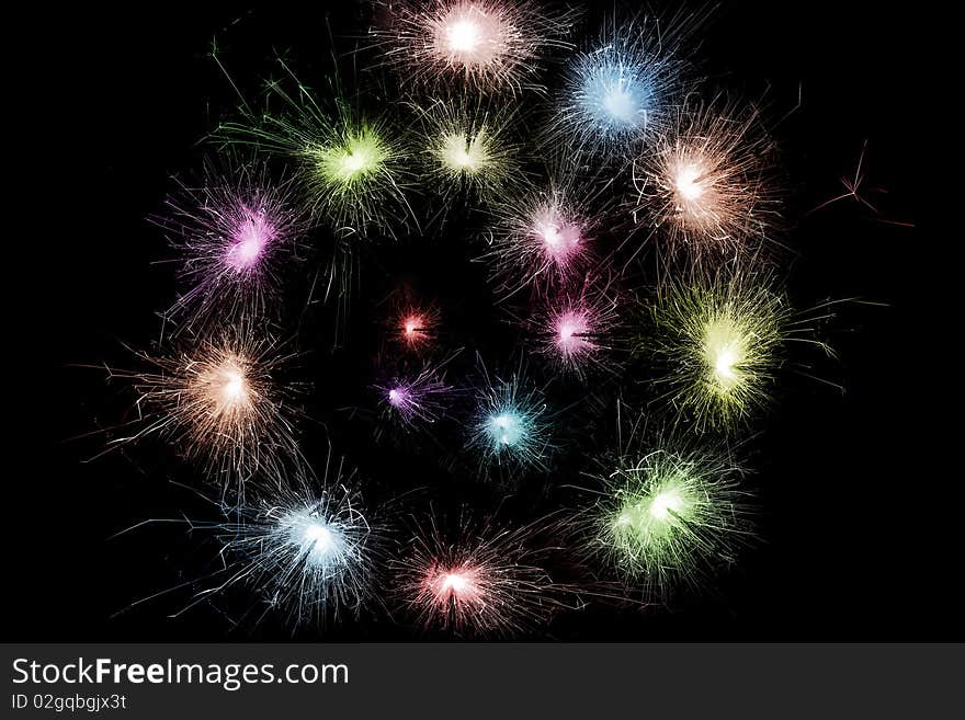 Color sparkler spiral isolated on black background