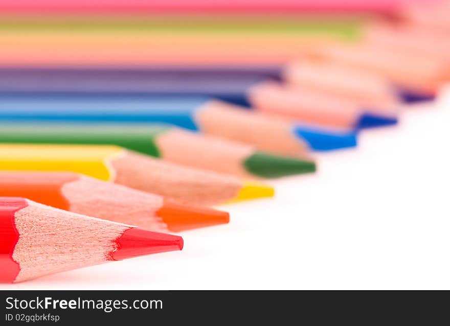 Close-up image of multicolor pencils isolated on white background