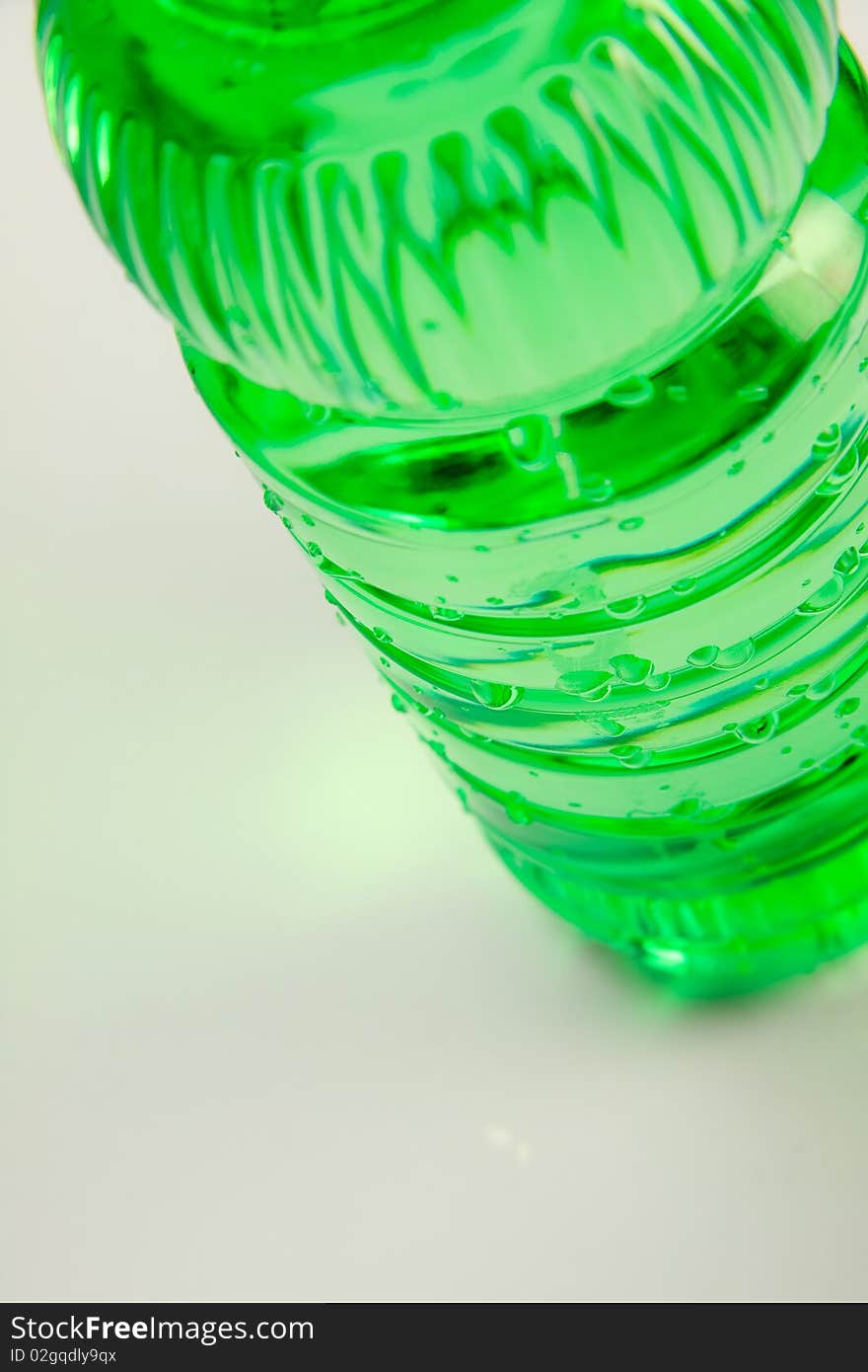 A plastic bottle filled with still water. Image isolated on white studio background. A plastic bottle filled with still water. Image isolated on white studio background.