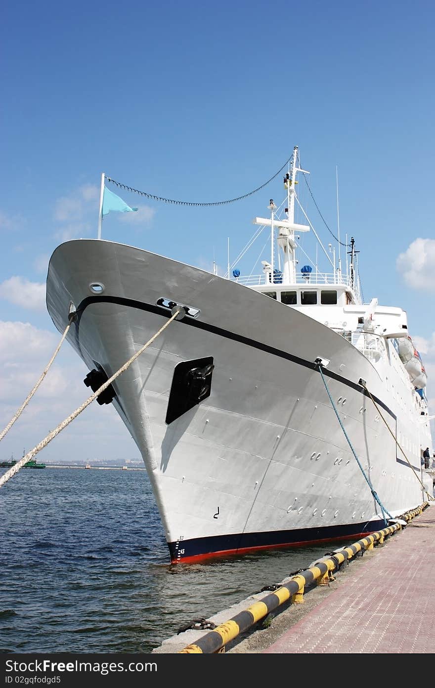 White vessel anchored in sea port. White vessel anchored in sea port