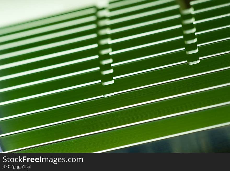 Close-up of a green computer video adapter passive cooler. Shallow dof. Close-up of a green computer video adapter passive cooler. Shallow dof.