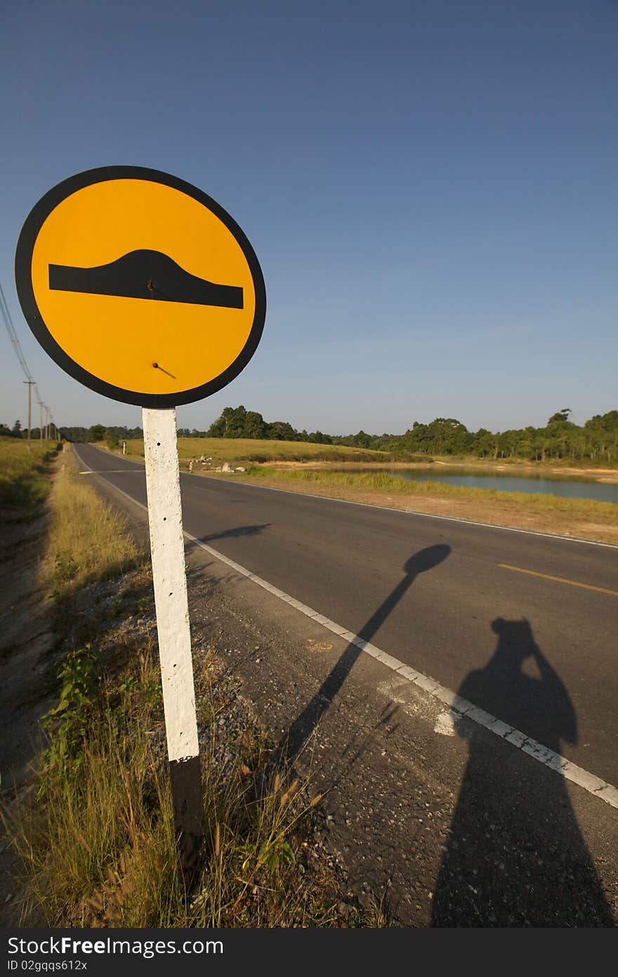 The traffic sign of bumpy road ahead. The traffic sign of bumpy road ahead.