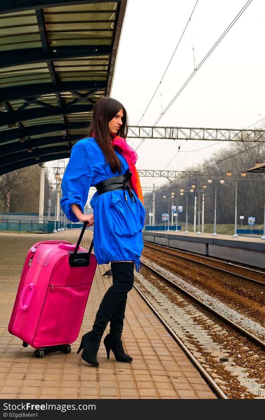 Woman with pink suitcase