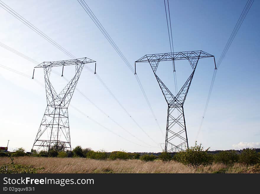 Two steel high voltage power line tower.