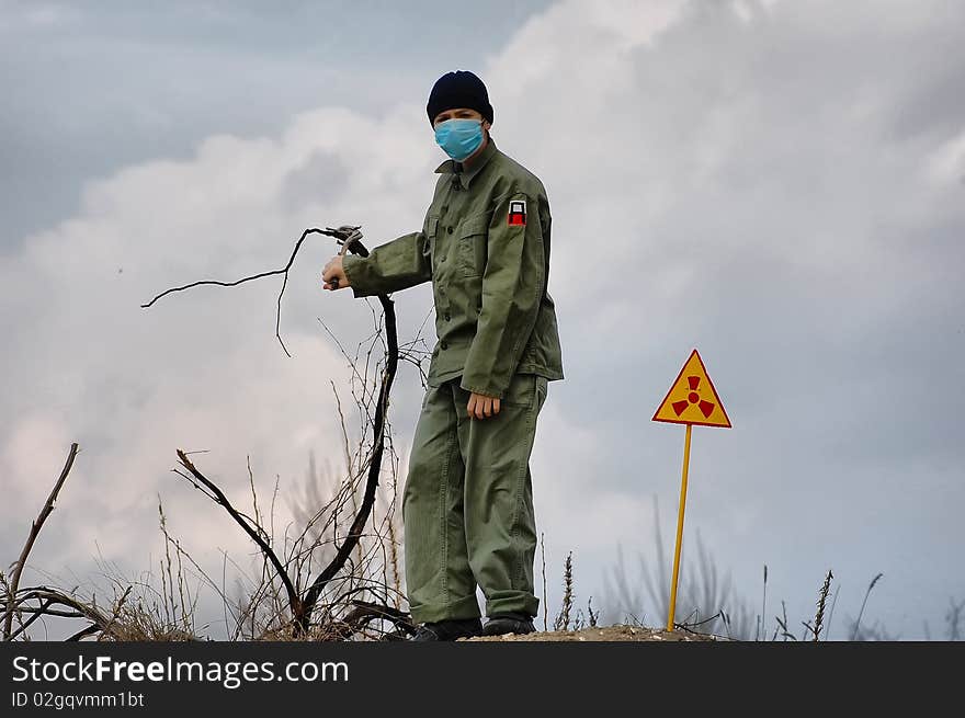 Teenager weared American military uniform.Lost city. Near Chernobyl area. Modern ruins. Ukraine. Kiev region. Teenager weared American military uniform.Lost city. Near Chernobyl area. Modern ruins. Ukraine. Kiev region