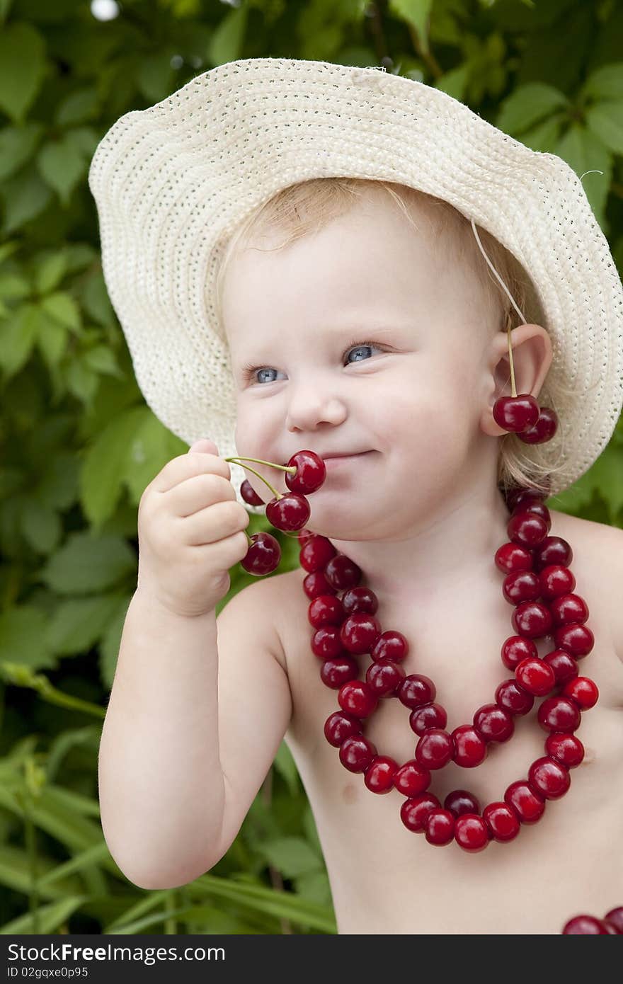 Girl with red cherry beads and earrings