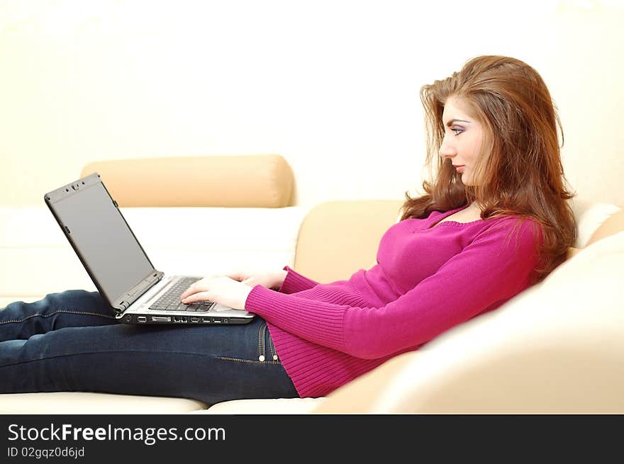 Beautiful young woman working on a laptop