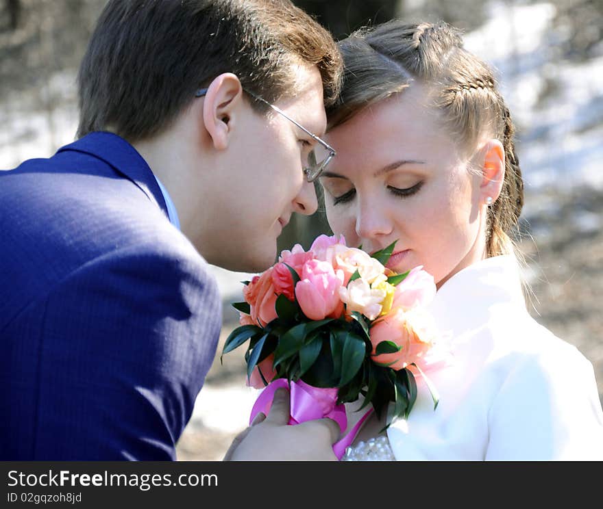 The beautiful girl and man with flowers. The beautiful girl and man with flowers.