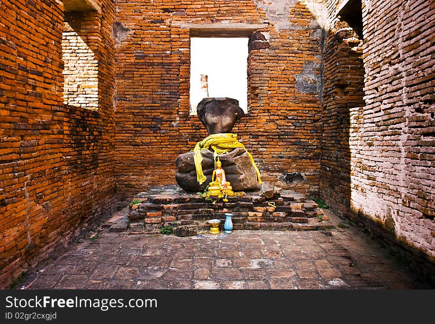 Headless buddha statue with altar in famous temple area Wat Phra Si Sanphet, Royal Palace in Ajutthaya