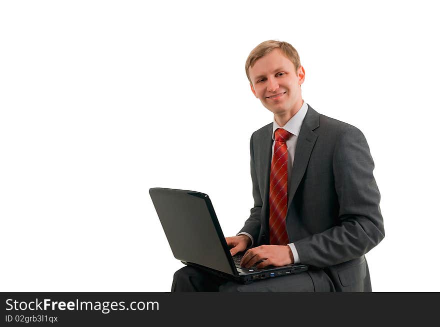 Very cheerful man the businessman works behind the computer