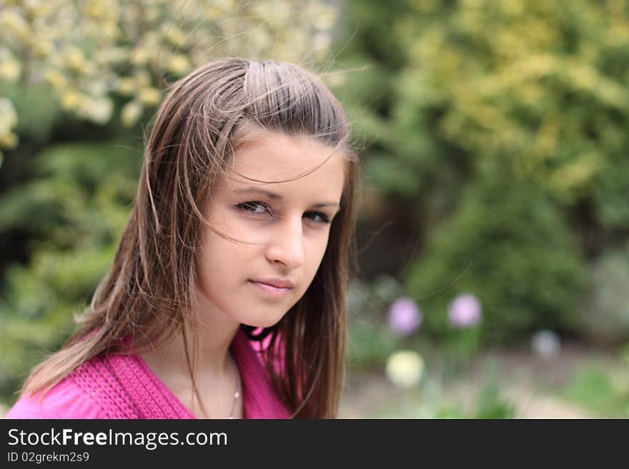 Portrait of the young girl on the flower background. Portrait of the young girl on the flower background