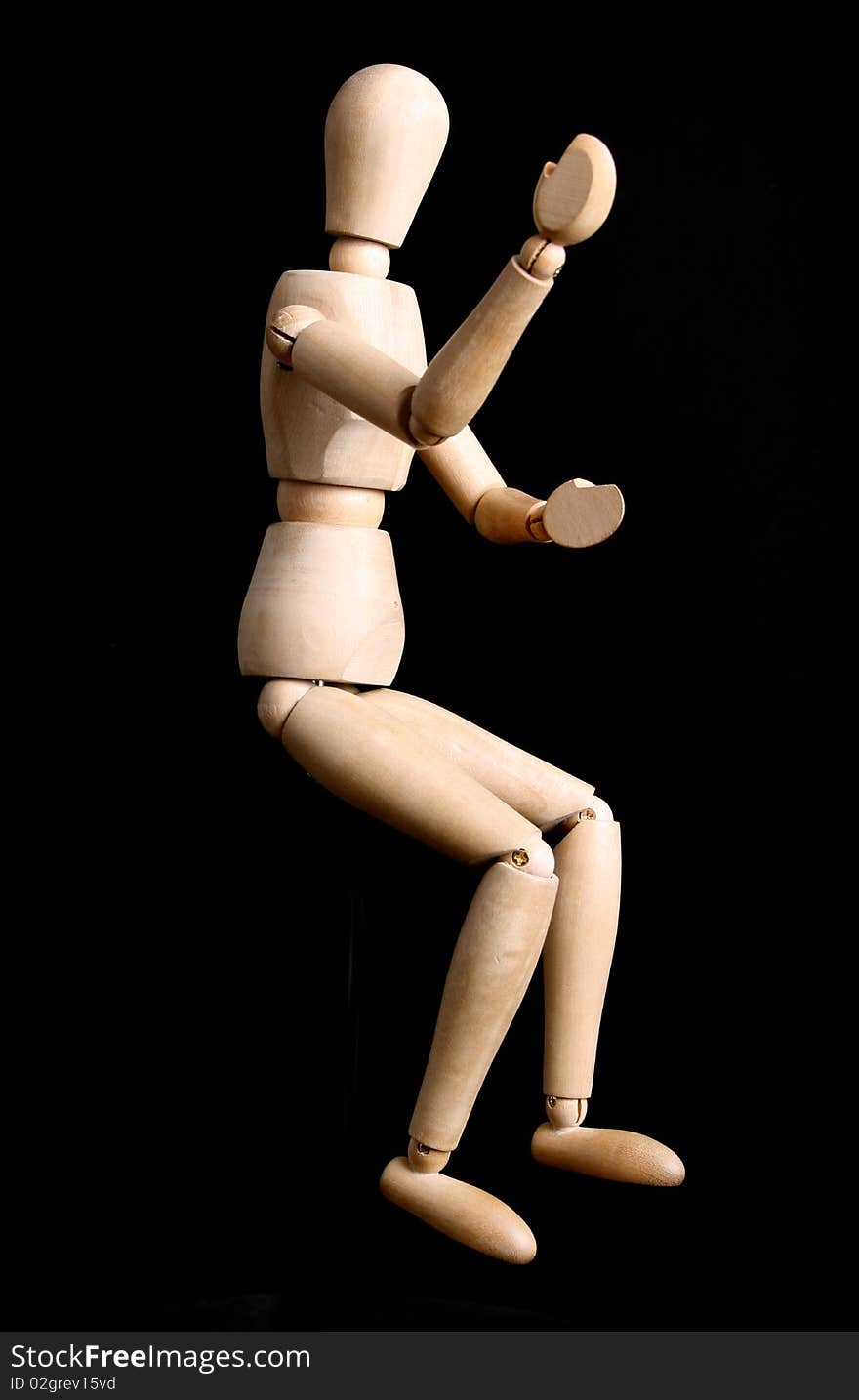 A manikin sitting in the black