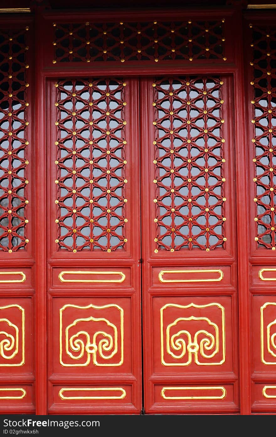 Decorative red door of a chinese ancient royal buddha temple