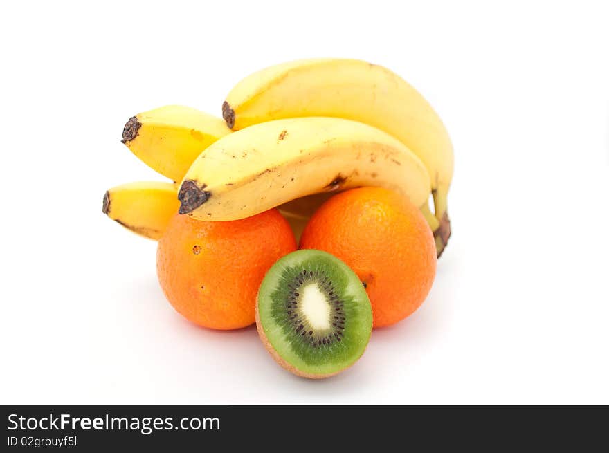 A bunch of bananas, oranges and a kiwifruit isolated on a white background. A bunch of bananas, oranges and a kiwifruit isolated on a white background