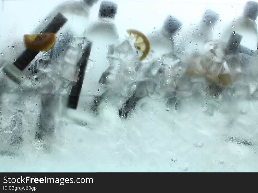 Bottles of mineral water or drinks in ice. Bottles of mineral water or drinks in ice