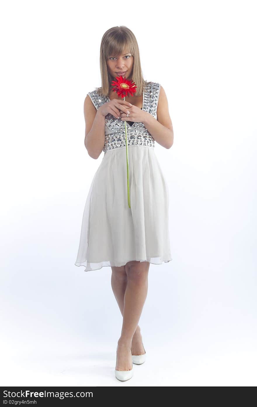 Slender girl with a flower on a white background. Slender girl with a flower on a white background