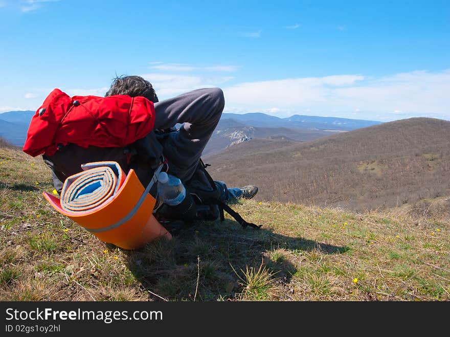 Hiker sits on the slope