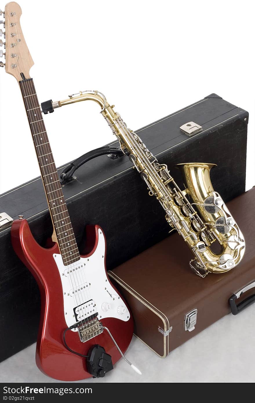 Red electric guitar and gold sax