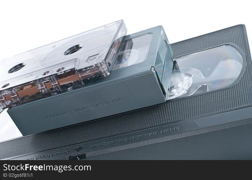 Compact videocassette, VHS and audio cassette isolated on white background