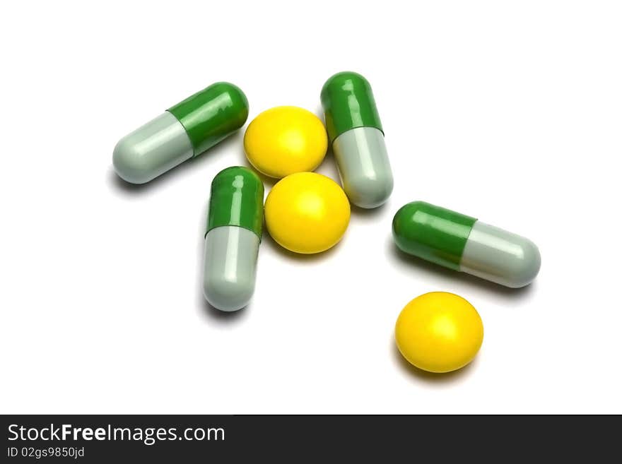 Some pills on white background