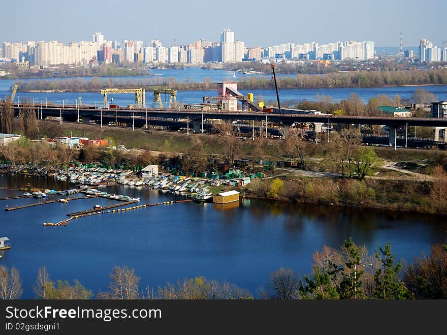 View on Kiev Left bank, yacht station, bridge and a concrete factory. View on Kiev Left bank, yacht station, bridge and a concrete factory