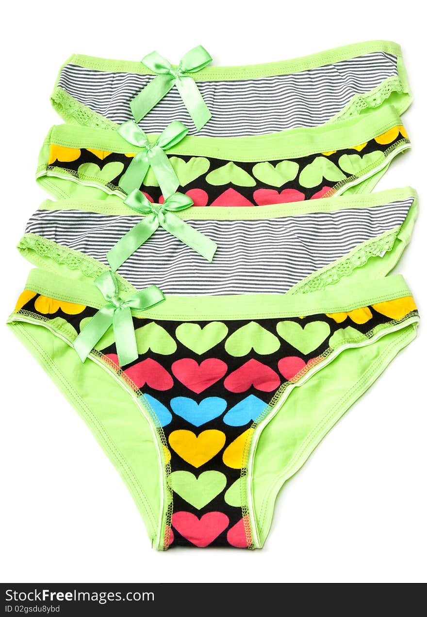 Four green feminine panties with pattern in the manner of heart on white background