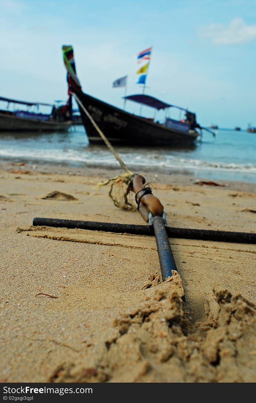 Longboat anchored on the beach, thailand, phuket.