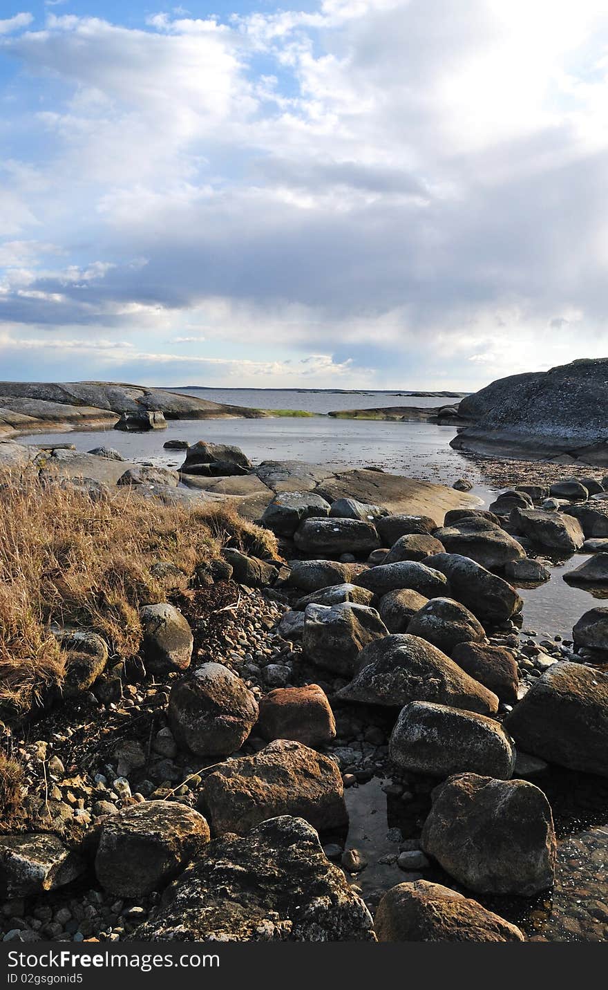 Wild Baltic sea coast with cloudy sky. Wild Baltic sea coast with cloudy sky