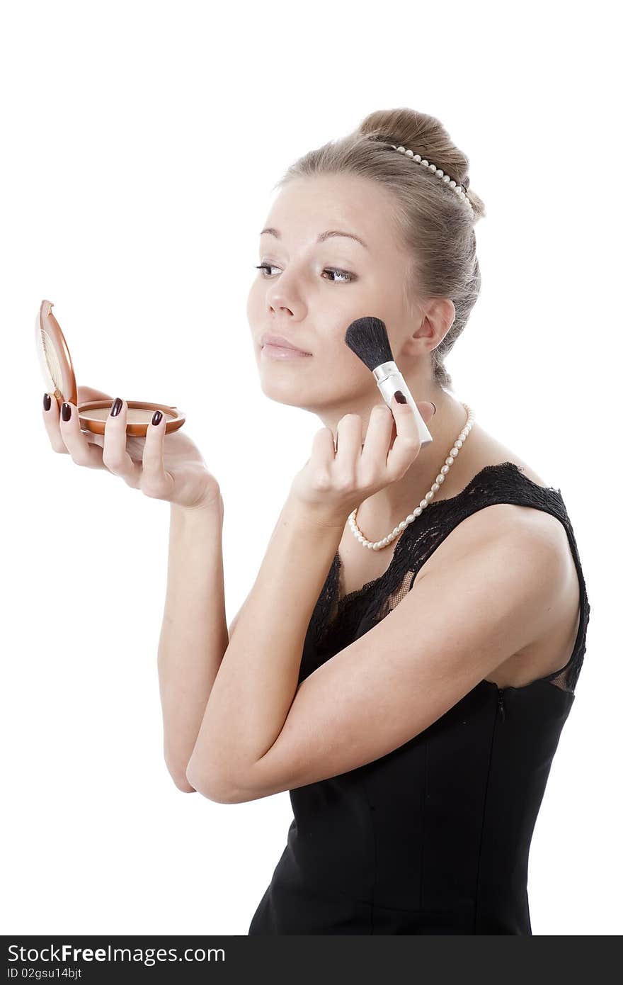 Girl with powder brush isolated on white