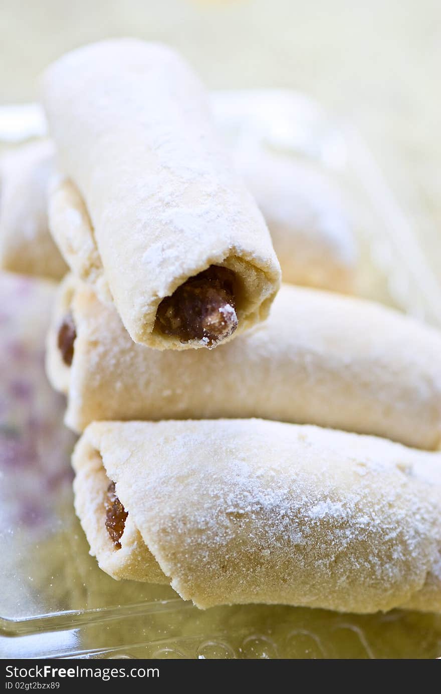 Cookies croissants with jam strewed by powdered sugar. Cookies croissants with jam strewed by powdered sugar