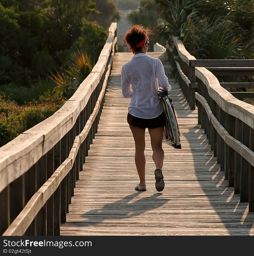 Woman Walking On Footbridge