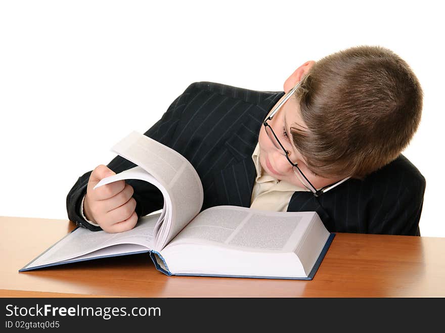 Boy with points reads book isolated in white