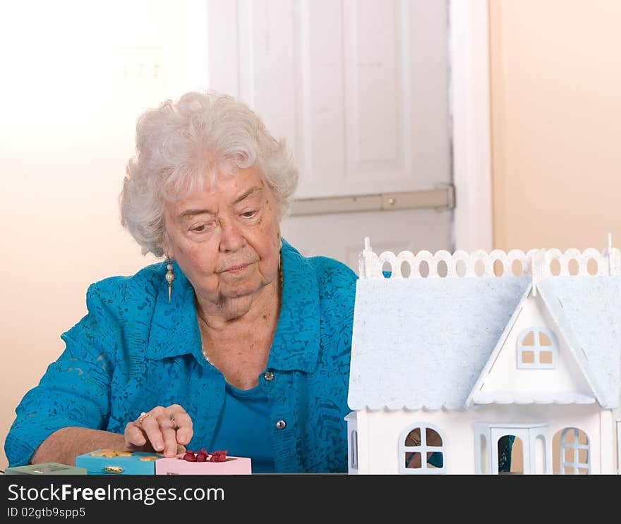 Senior citizen woman working on her crafts. Senior citizen woman working on her crafts