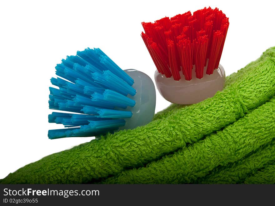 Two brushes for ware washing lie on towel