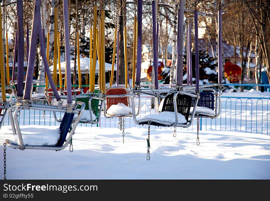 Forgotten swings in the winter park