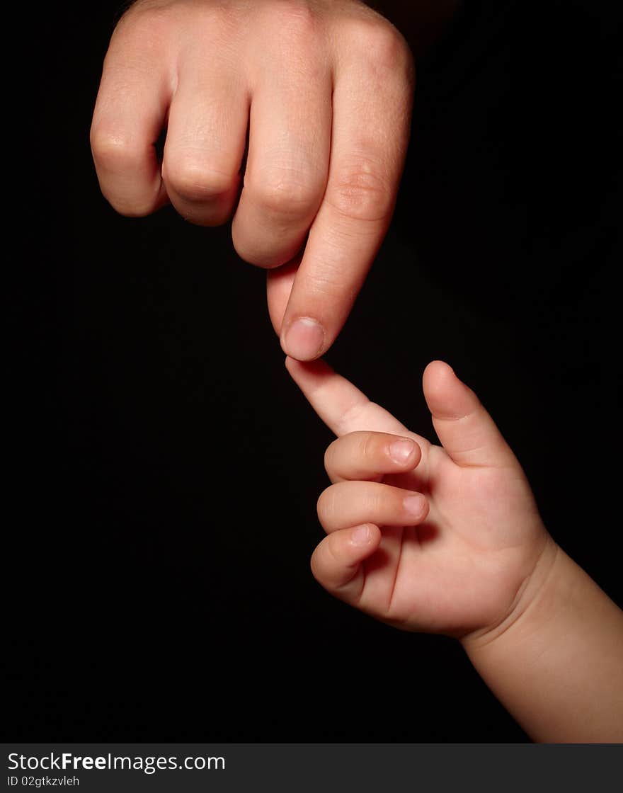 Hands. loving touch of father and son