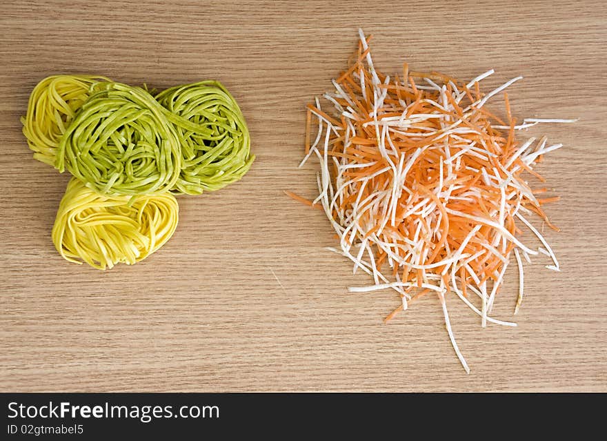 Homemade pasta and freshly cut vegetables for salad. Homemade pasta and freshly cut vegetables for salad