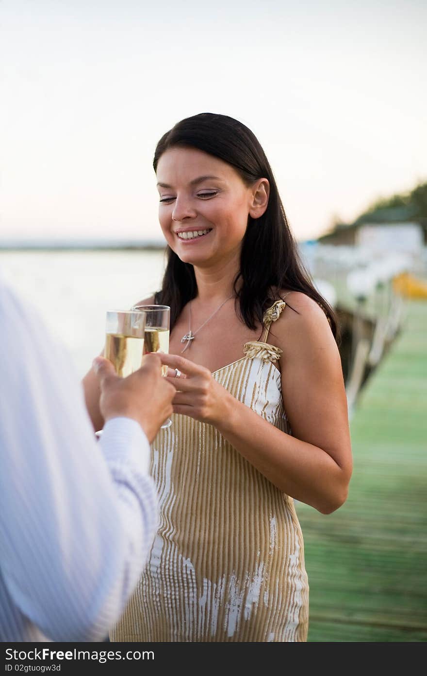 Young couple toasting champagne glasses. Young couple toasting champagne glasses.