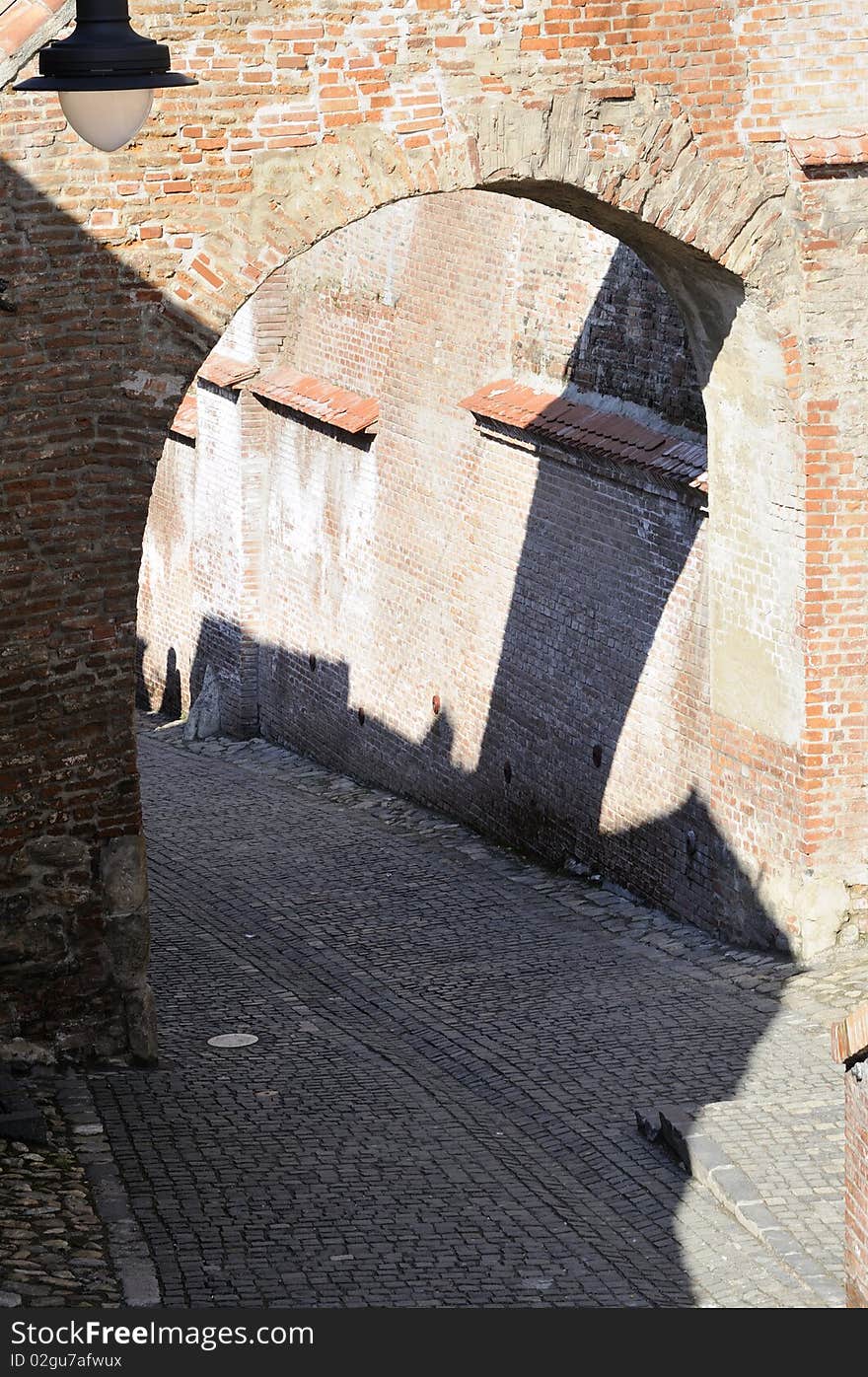 Shadows on walls and street from old city infrastructure. Shadows on walls and street from old city infrastructure