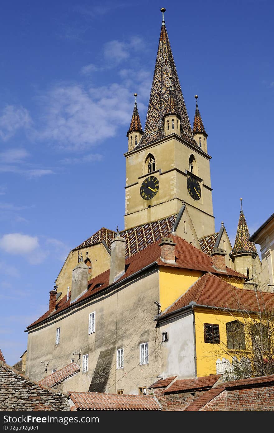 One old building towers with blue sky in background. One old building towers with blue sky in background