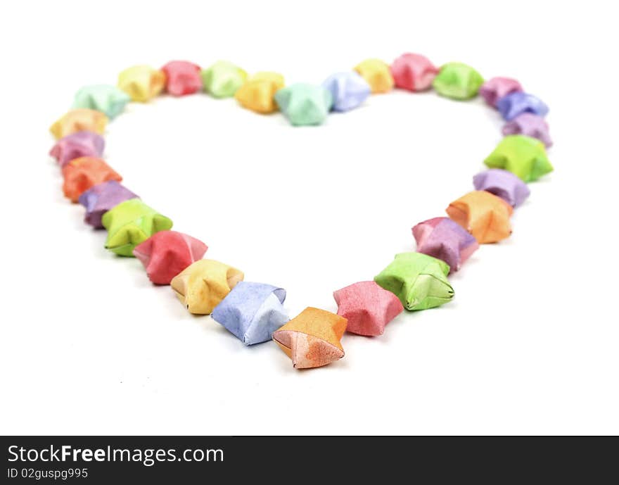 Color lucky stars origami heart on white background