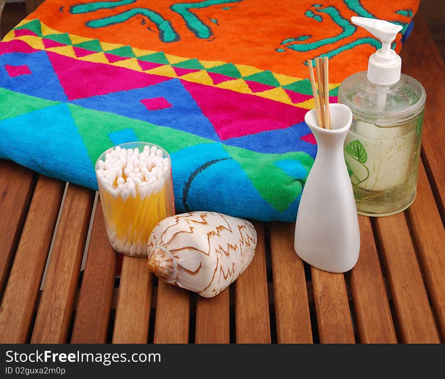 Spa concept of brown color: the towel, soap and candles over sisal background