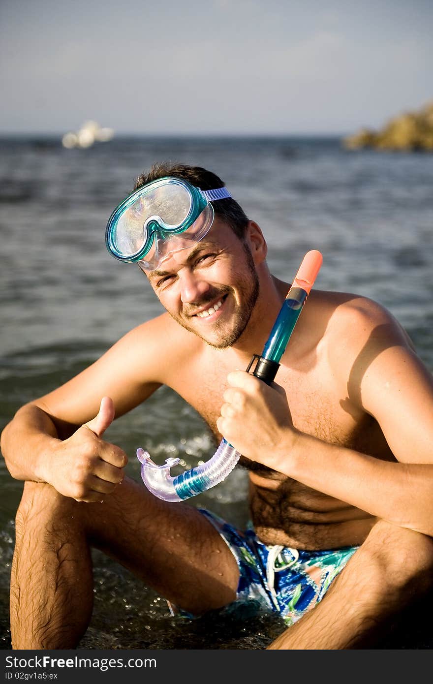 Young summer diving man with swimming mask