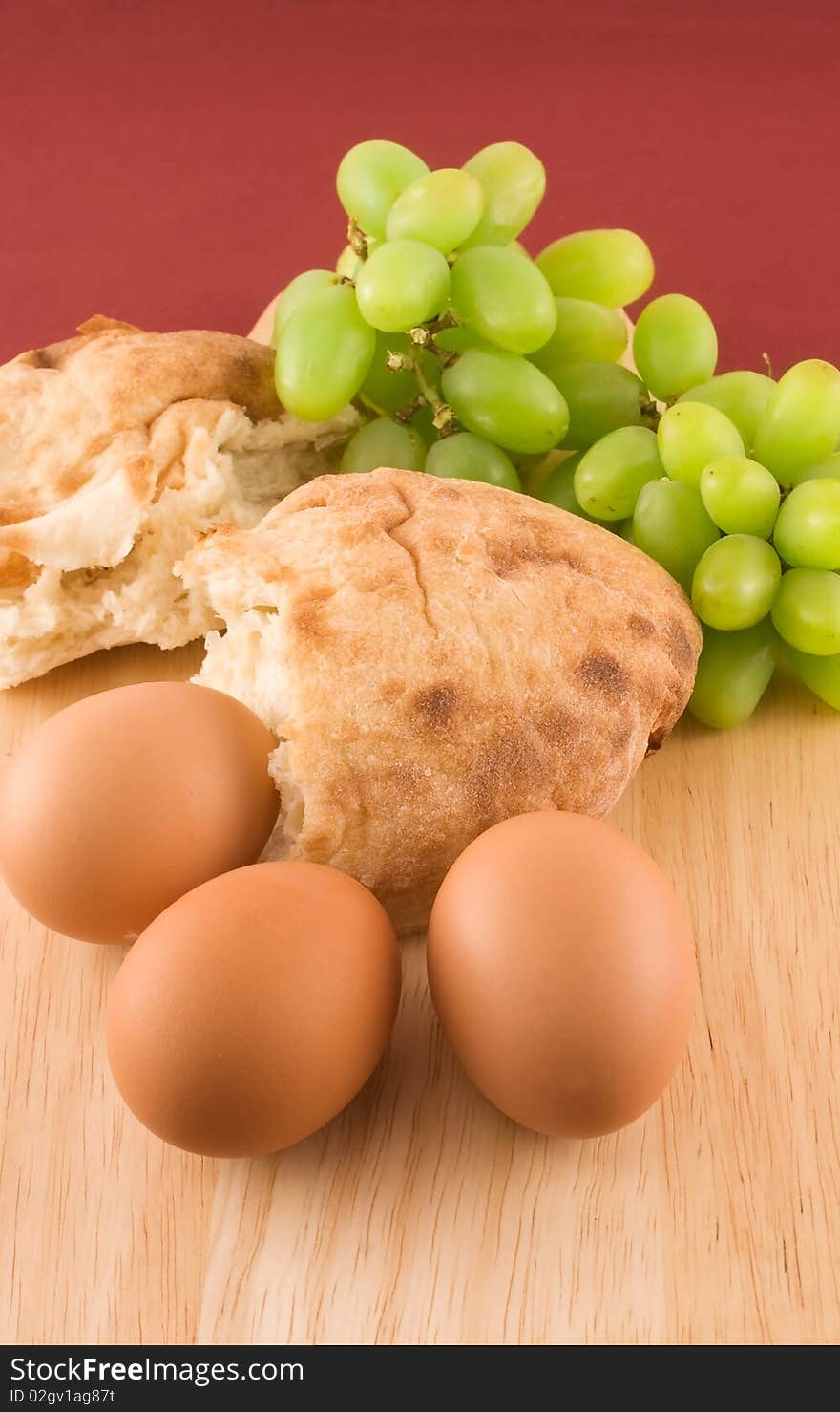 Fresh bread with eggs  and grapes