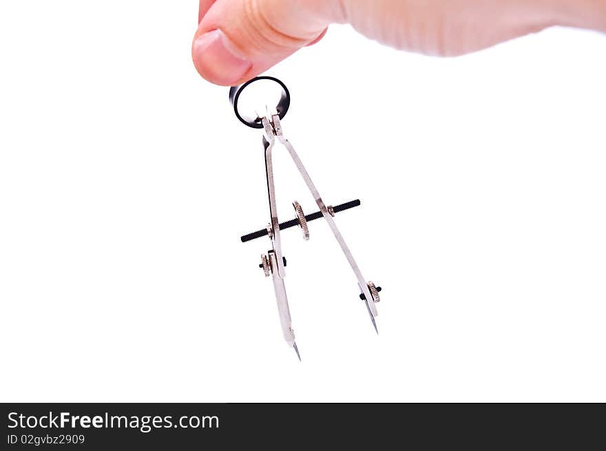 Graphics compass for technical drawing in man hand. Isolated on white. Graphics compass for technical drawing in man hand. Isolated on white