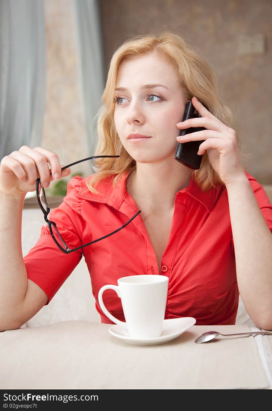 Young blond girl in cafe