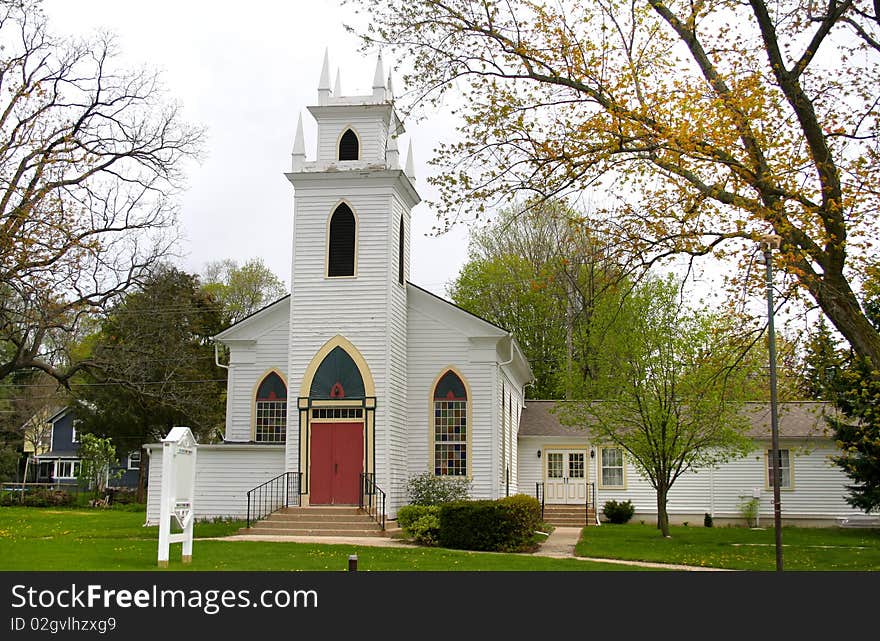 Historic church in small village of Michigan in spring time