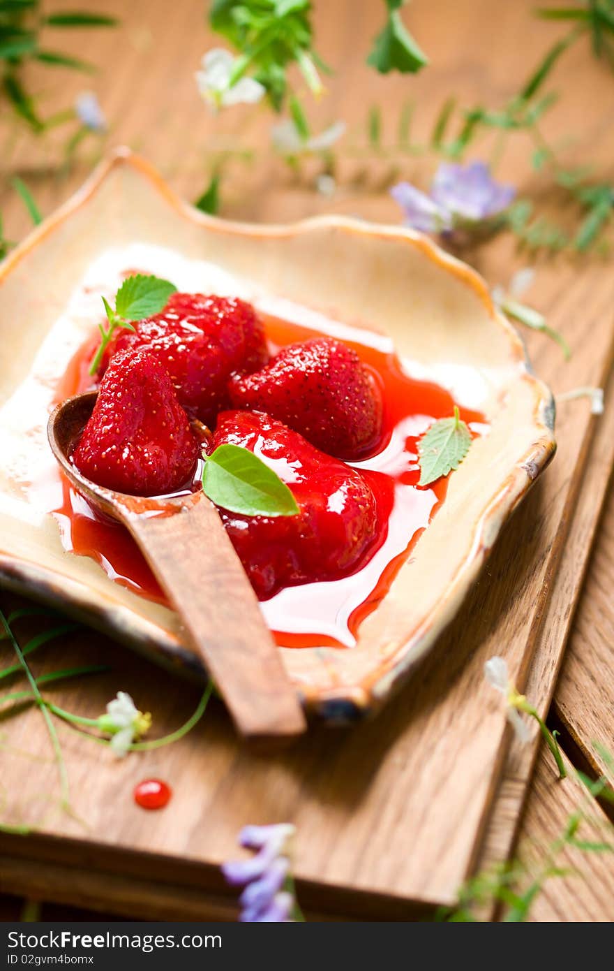 Homemade strawberry jam with mint and basil