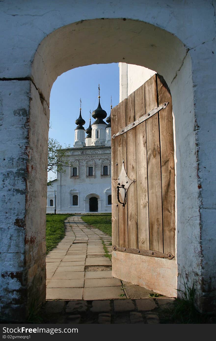 Through the doorway is visible church. Through the doorway is visible church