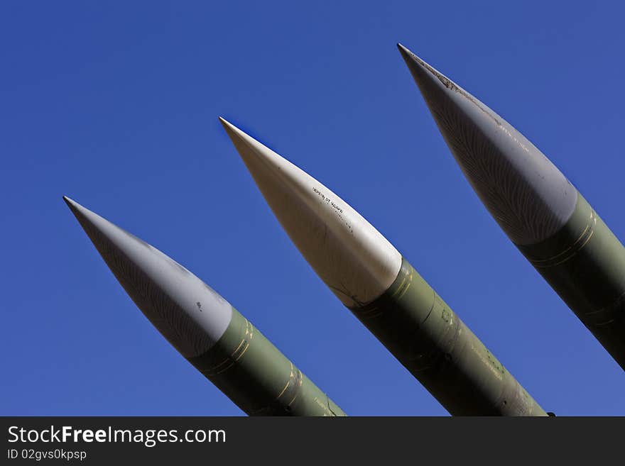 Three missiles on the blue background